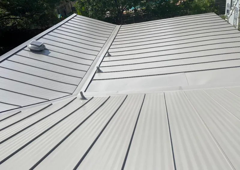Solar attic fan installed on a metal roof for Roof Ventilation in Cimarron Hills